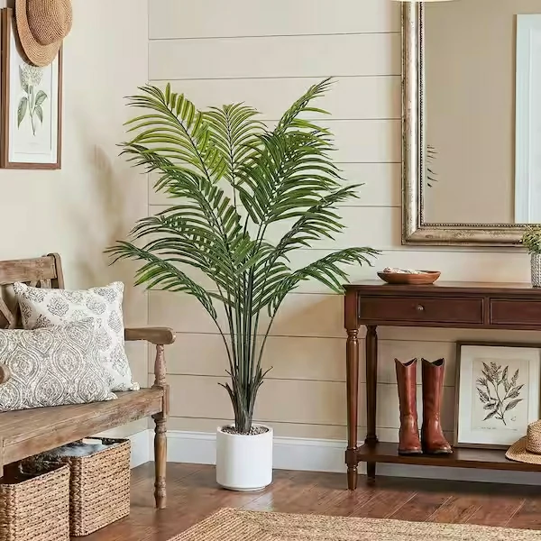 Realistic artificial palm tree used for indoor interior decoration, creating a natural tropical atmosphere for residential and commercial spaces.